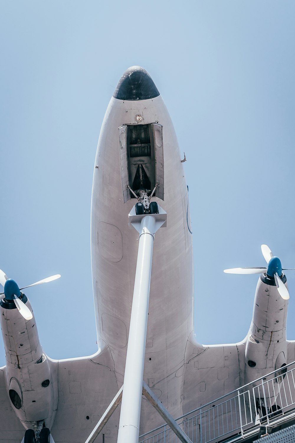 white and black airplane under blue sky during daytime