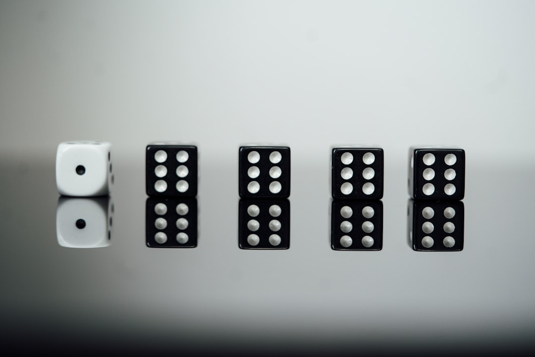 white and black dices on white surface