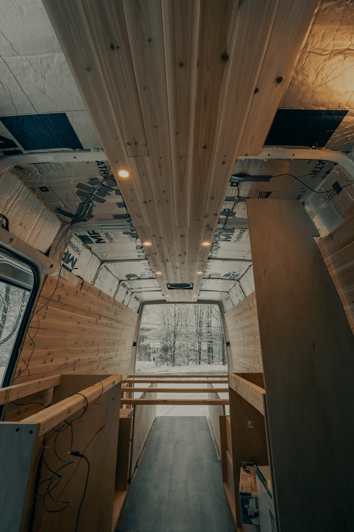 Fitting windows and lining the walls of a van conversion