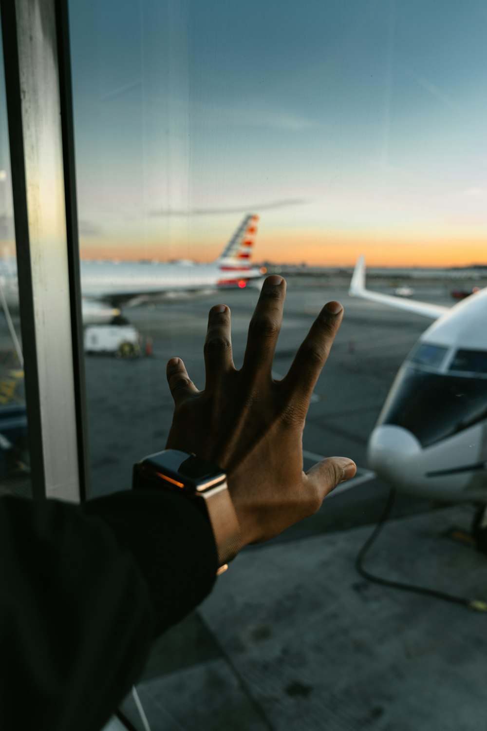 person wearing black watch and black leather strap