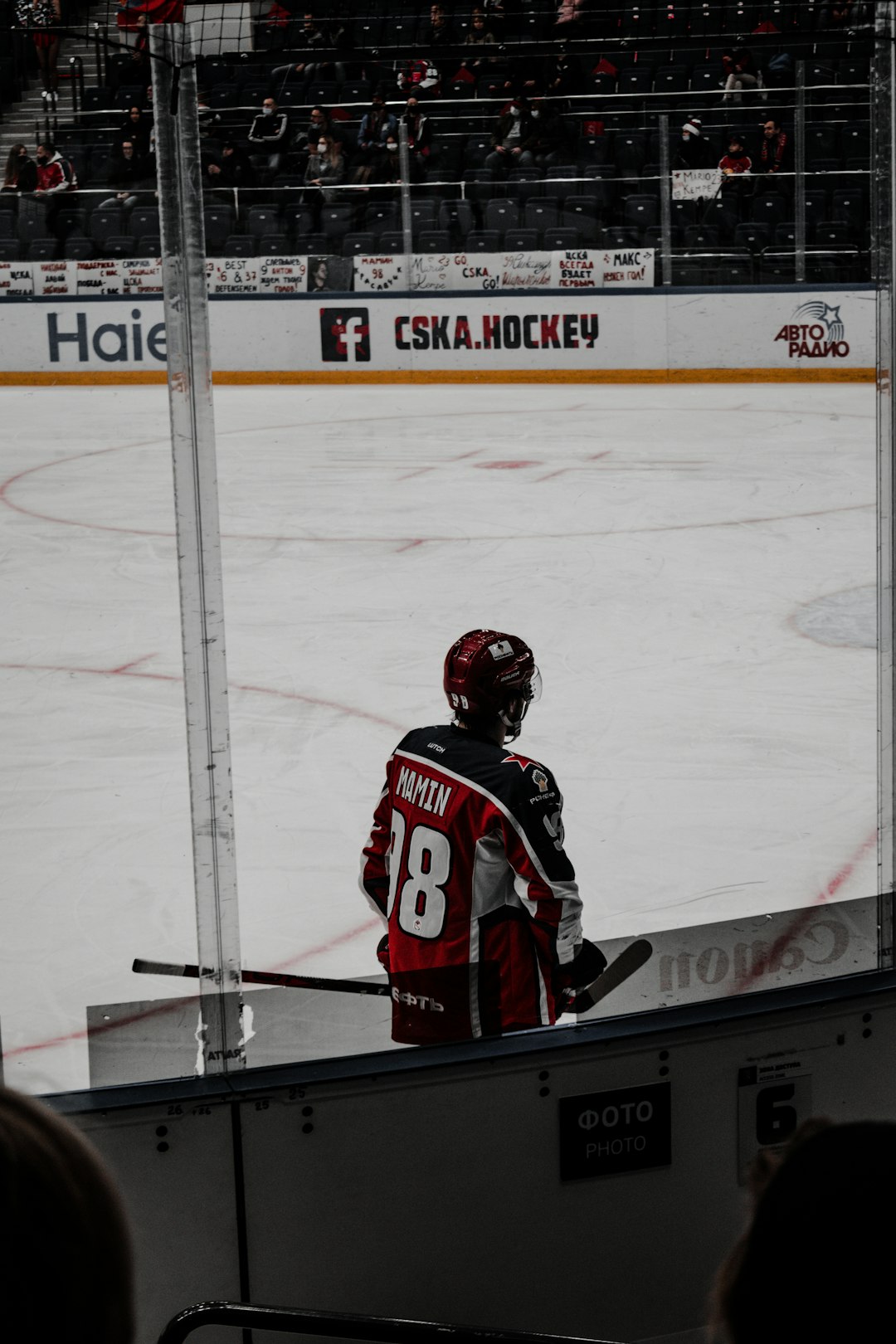 man in red and white ice hockey jersey shirt and helmet