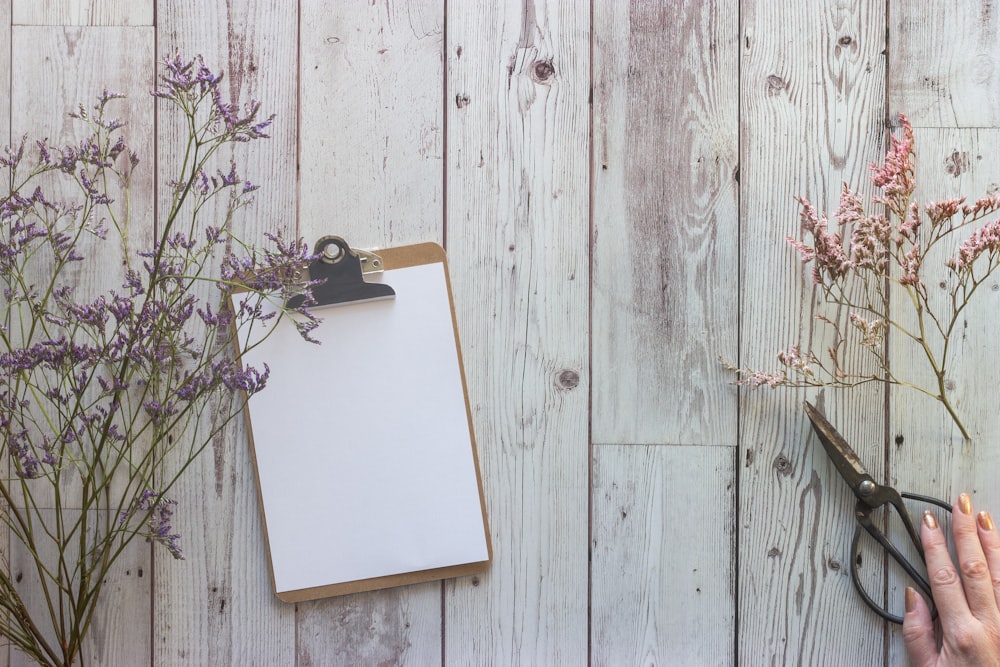 white book on brown wooden table