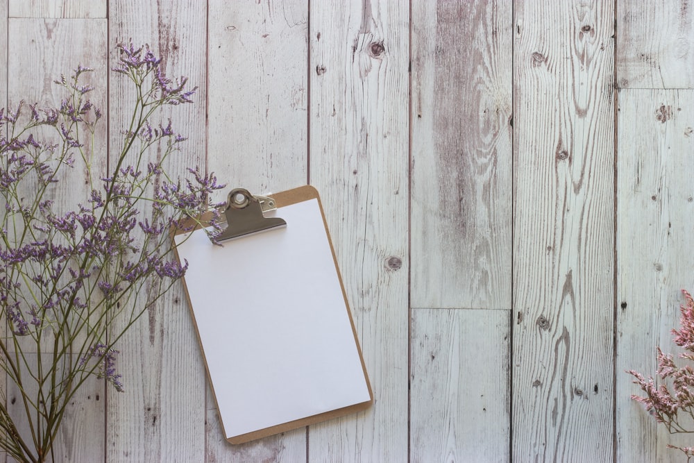 white book on brown wooden table