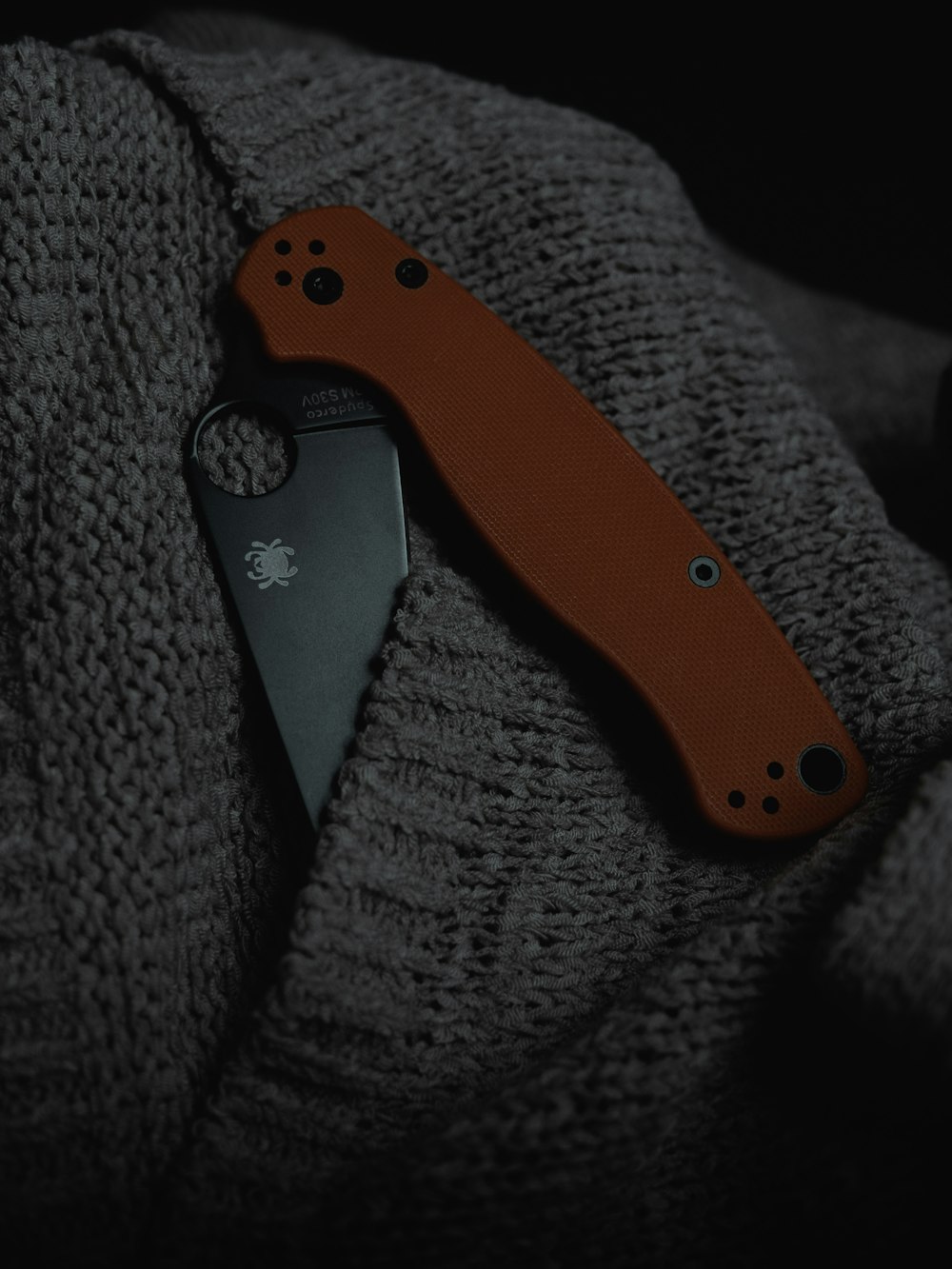 black and orange pocket knife
