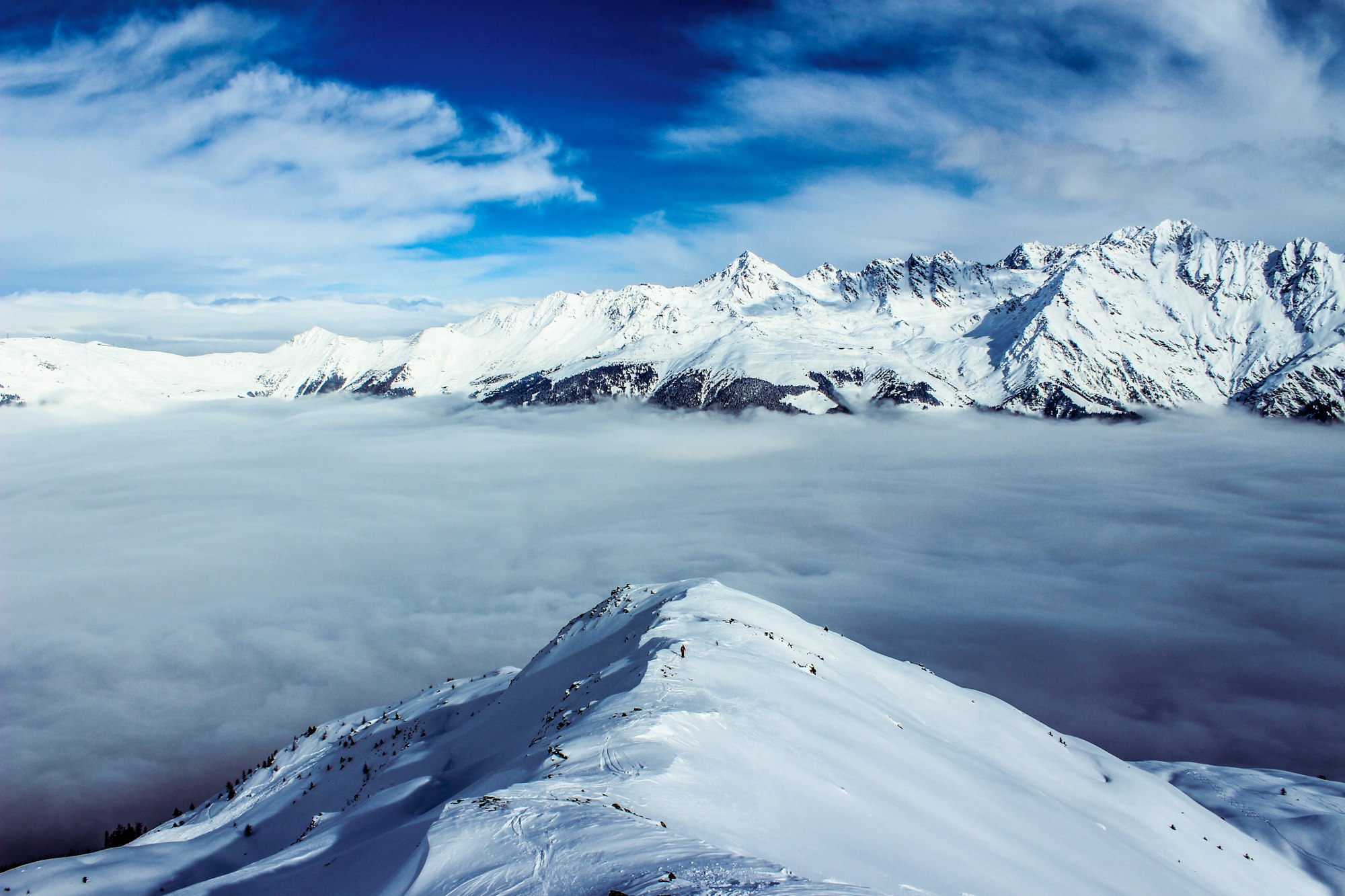 Panoramic view over the snow-capped peaks of the Four Valleys above Verbier, Switzerland