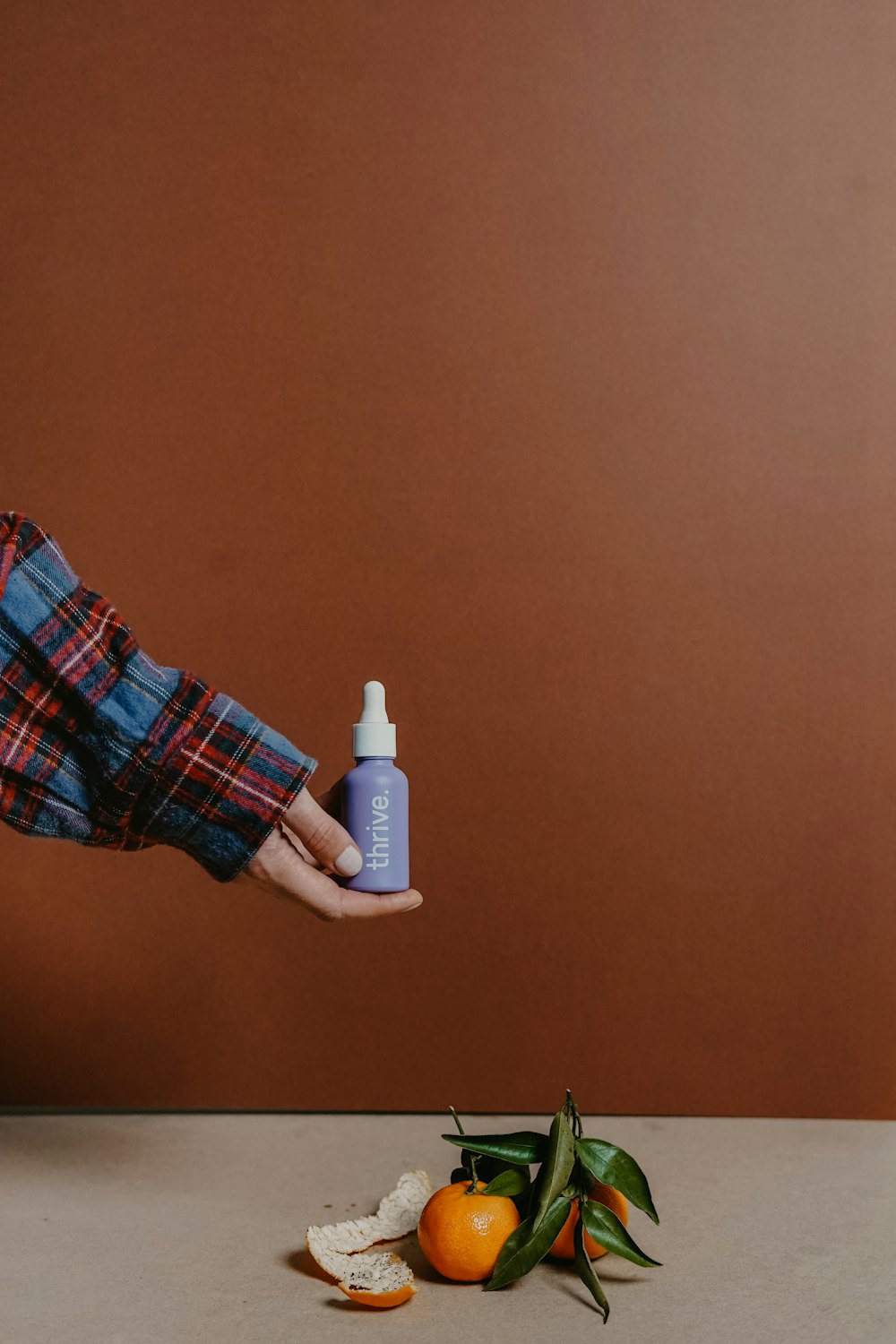 person holding white plastic bottle