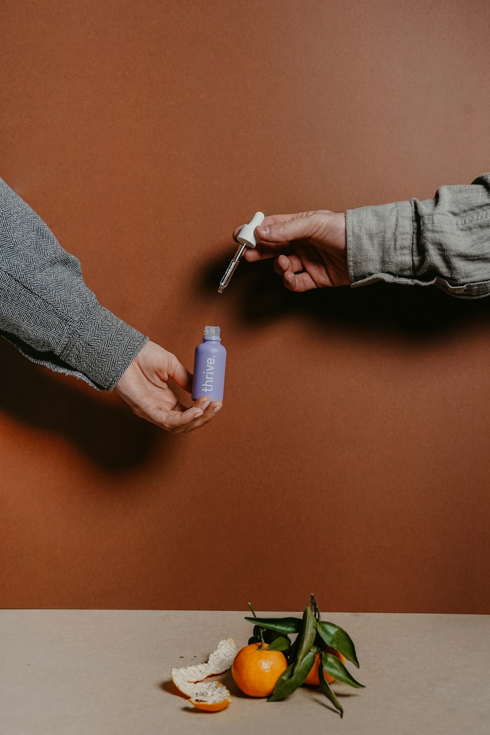 person holding blue and white plastic bottle