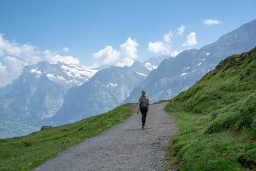 A person hiking in a scenic mountain landscape.