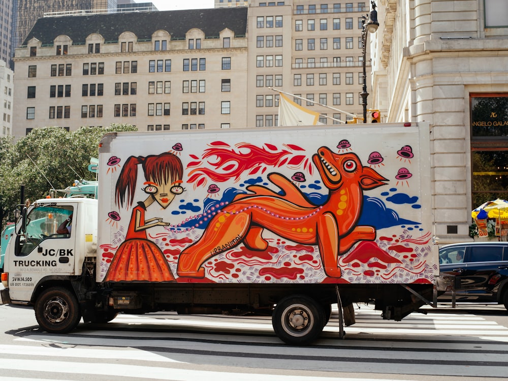 white red and yellow food truck on road during daytime