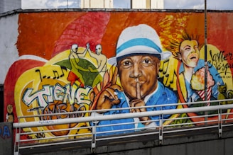 man in blue hat painting