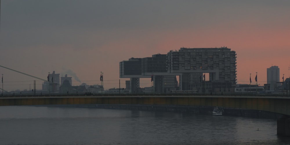 black concrete building near body of water during daytime