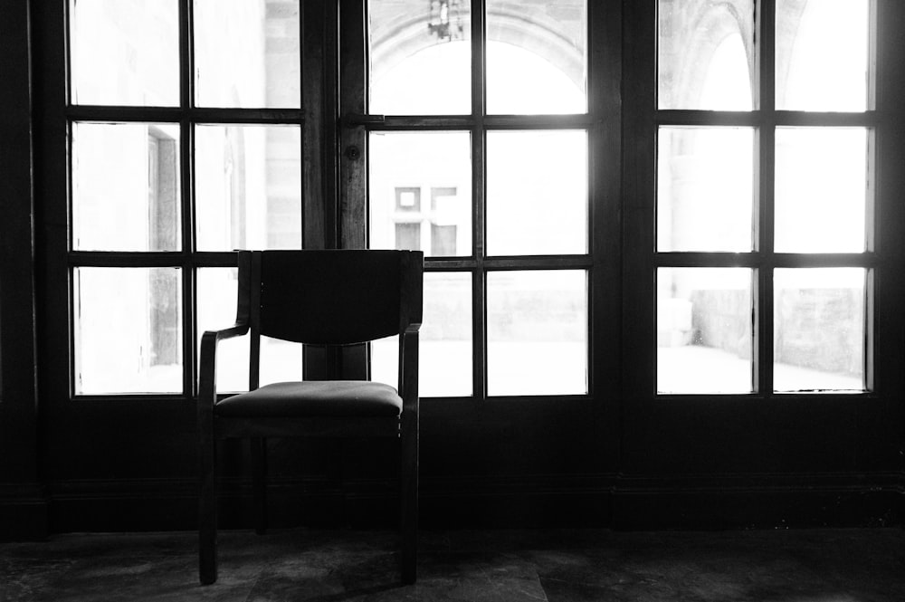 black wooden chair near window