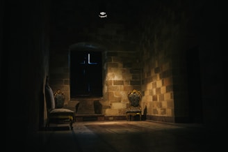 A softly lit corner of the love room, featuring elegant medieval-inspired decor and plush seating.