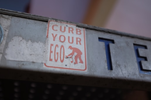 a close up of a street sign on a pole