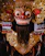 red and gold mask with red and gold colored wings