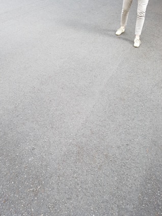Contemporary streetwear pants arranged with soft shadows on a white surface