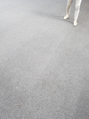 A pair of clean, simple tapered joggers laid out on a neutral surface.