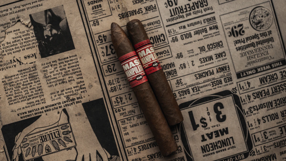 Premium box-pressed cigars resting on dark stained wood