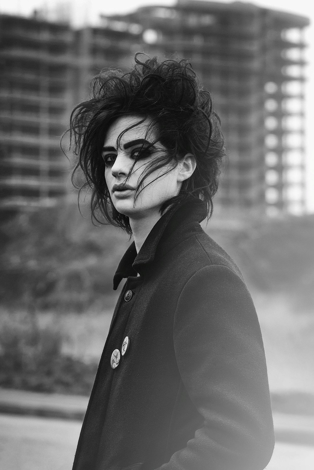 woman in black coat grayscale photo