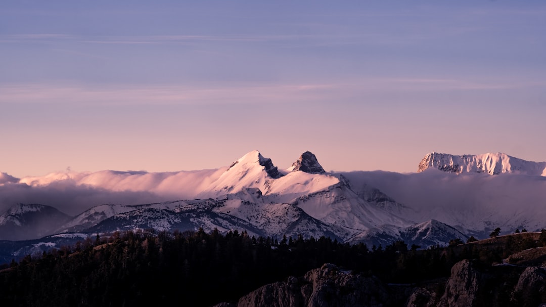 snow covered mountain during daytime