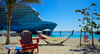 white and blue cruise ship on sea shore during daytime