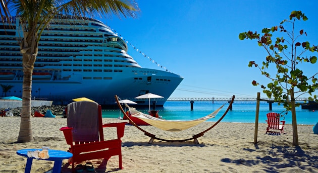 white and blue cruise ship on sea shore during daytime