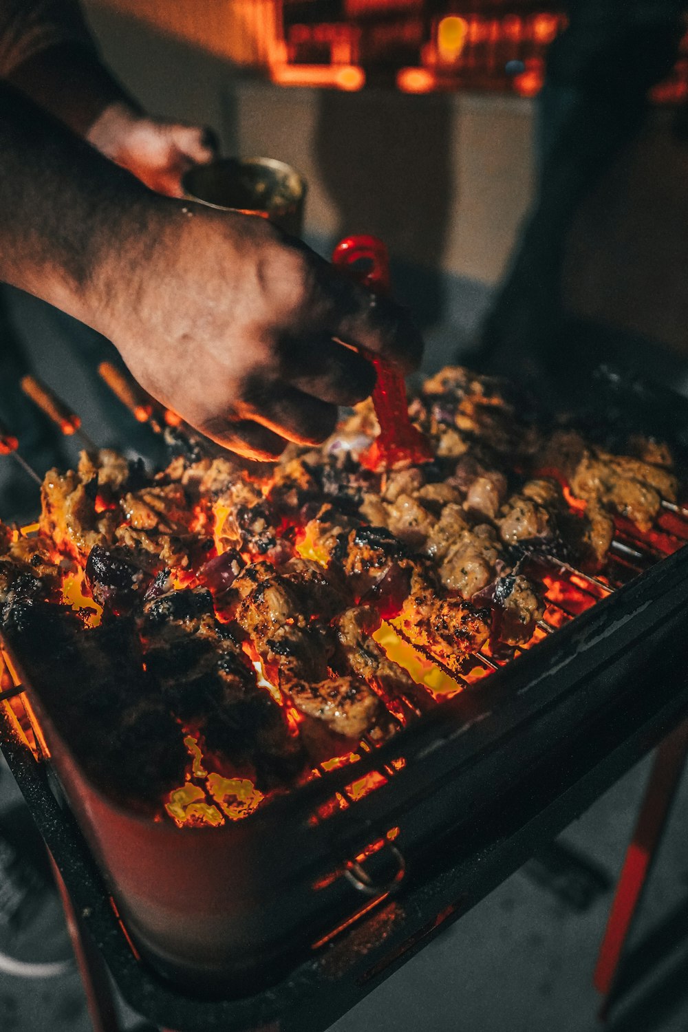 person holding black tray with food