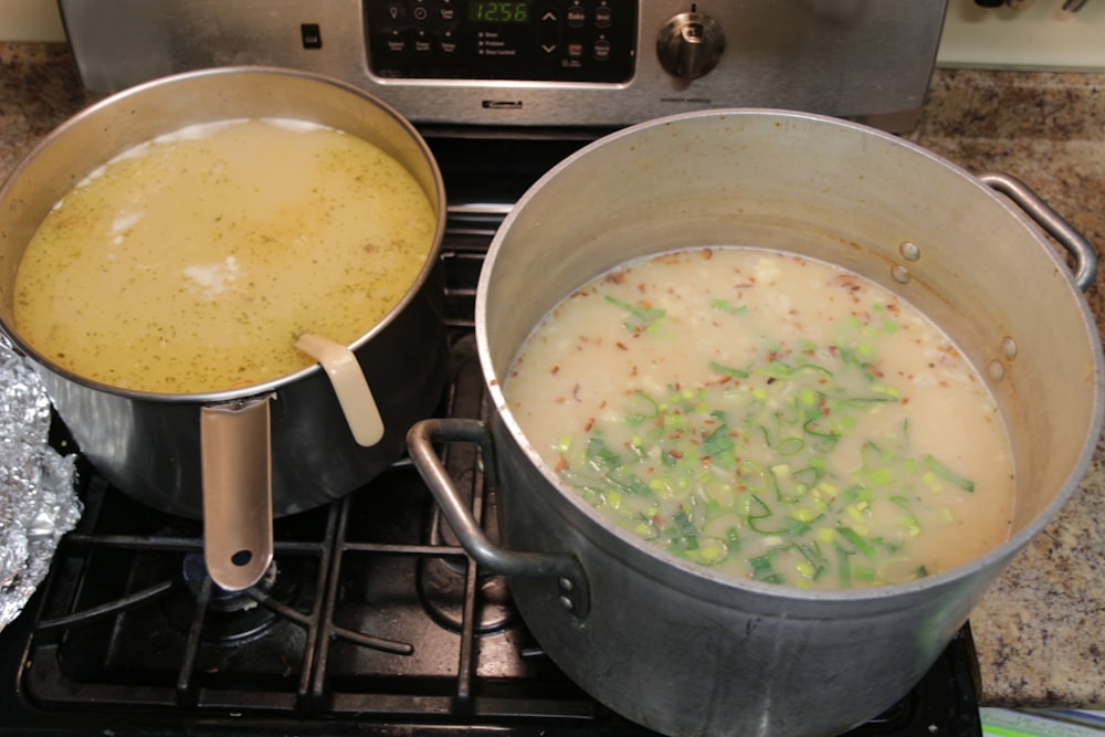 stainless steel cooking pot with green vegetable