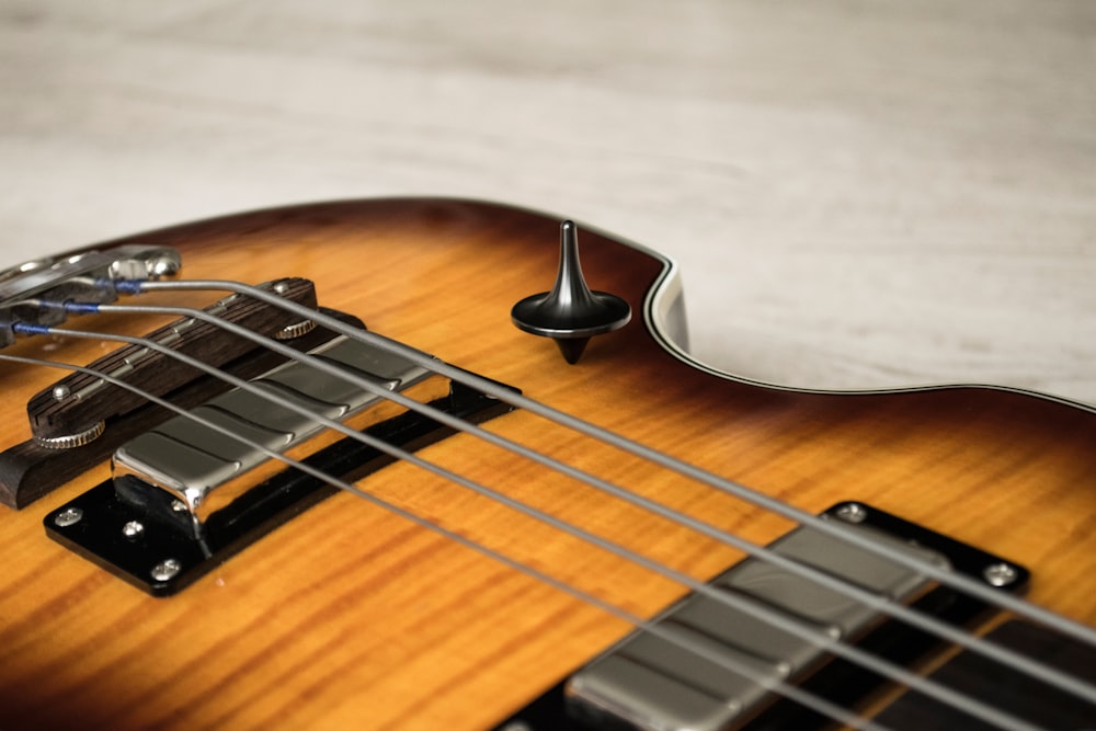 brown and black acoustic guitar