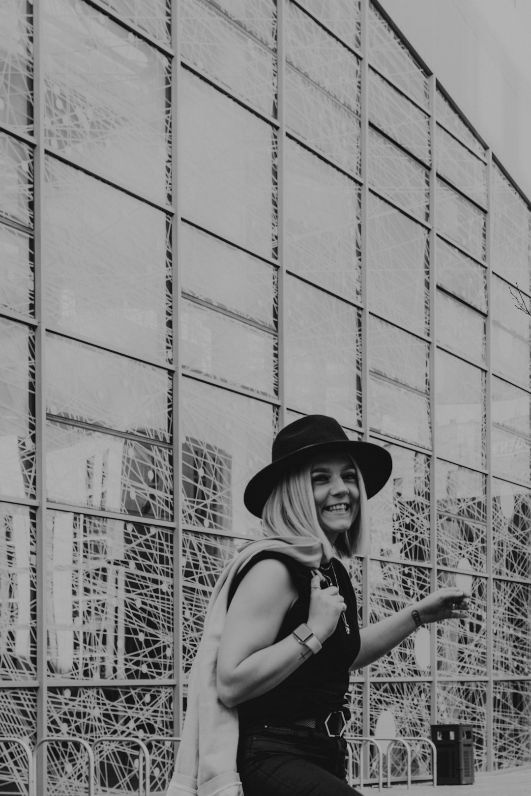 grayscale photo of woman in tank top and hat