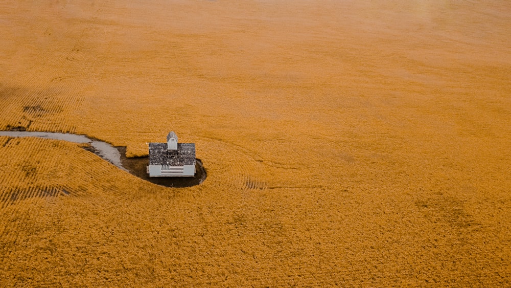 aerial view of gray building on brown sand