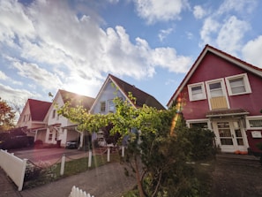 An image showing a family looking at homes.