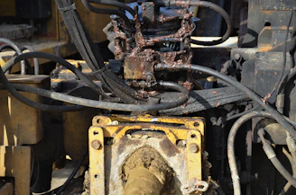 Hydraulic components including pumps and valves displayed with technical diagrams.