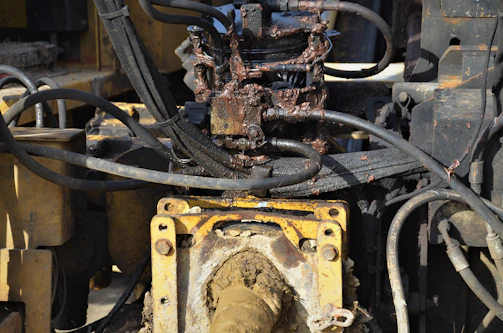 Stack of various second-hand hydraulic components for handling equipment