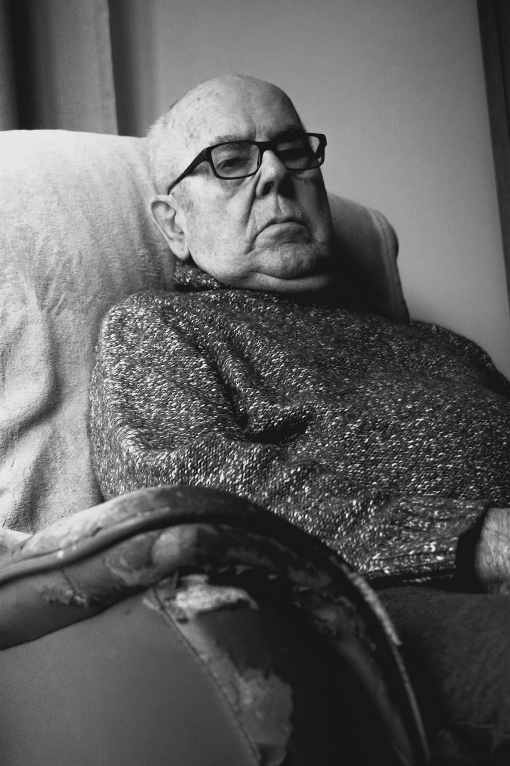 grayscale photo of man wearing eyeglasses