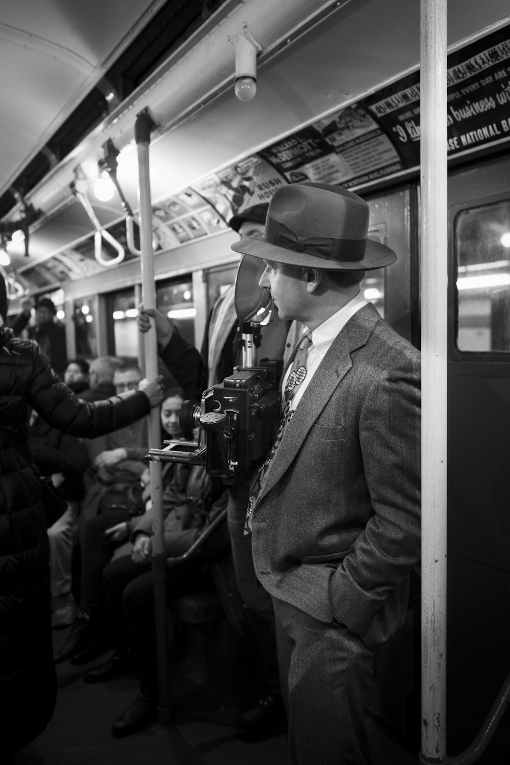 man in black hat and suit jacket