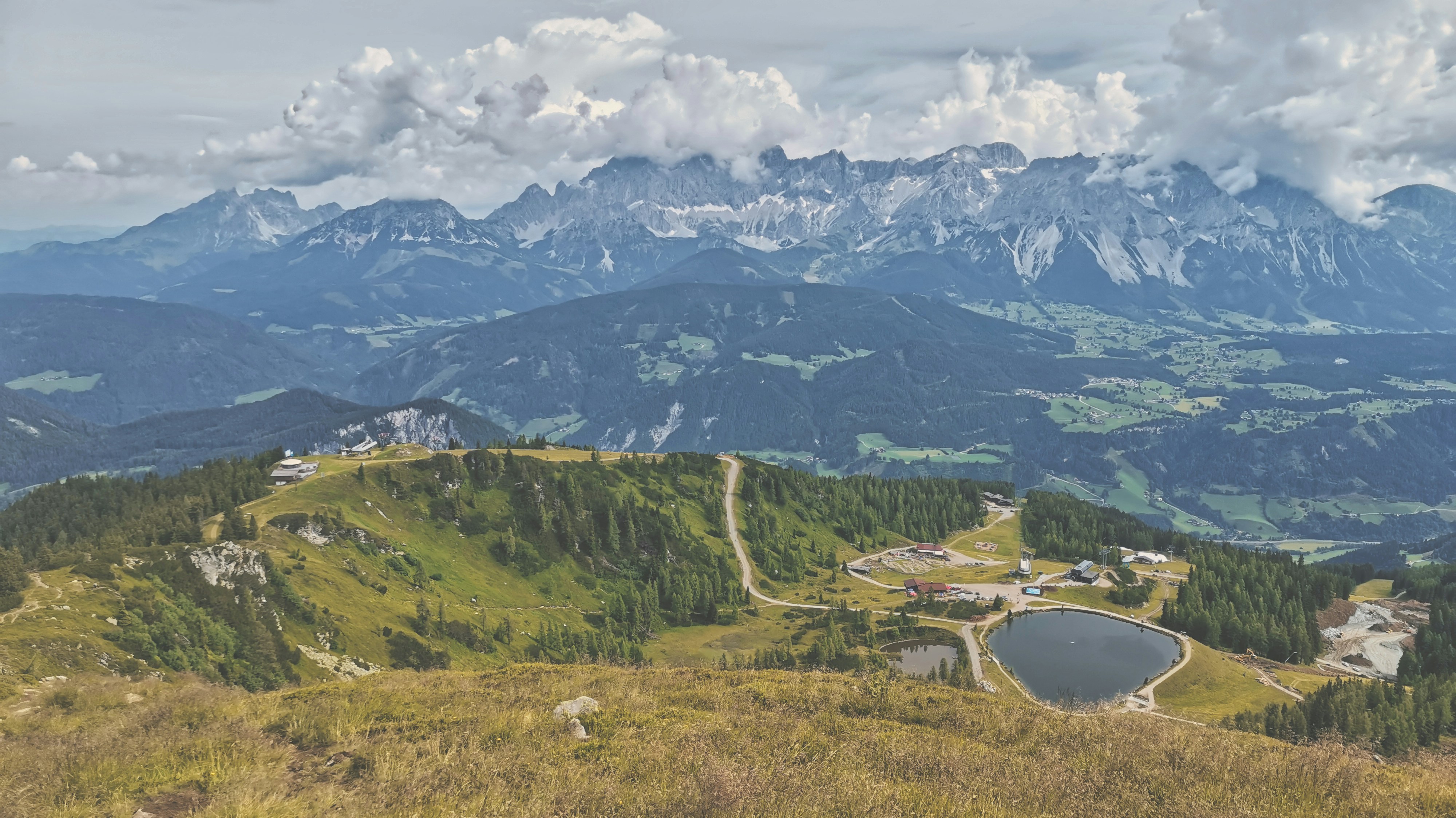 green trees and mountains during daytime