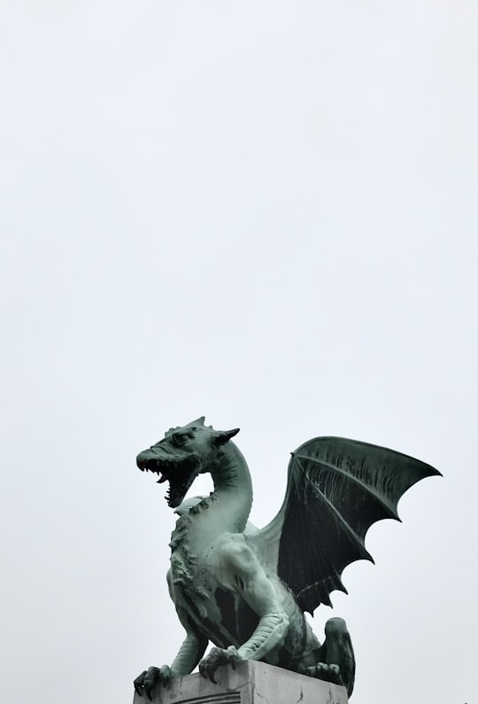 white horse statue in close up photography in Dragon Bridge Slovenia