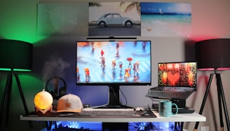 black flat screen computer monitor on white desk