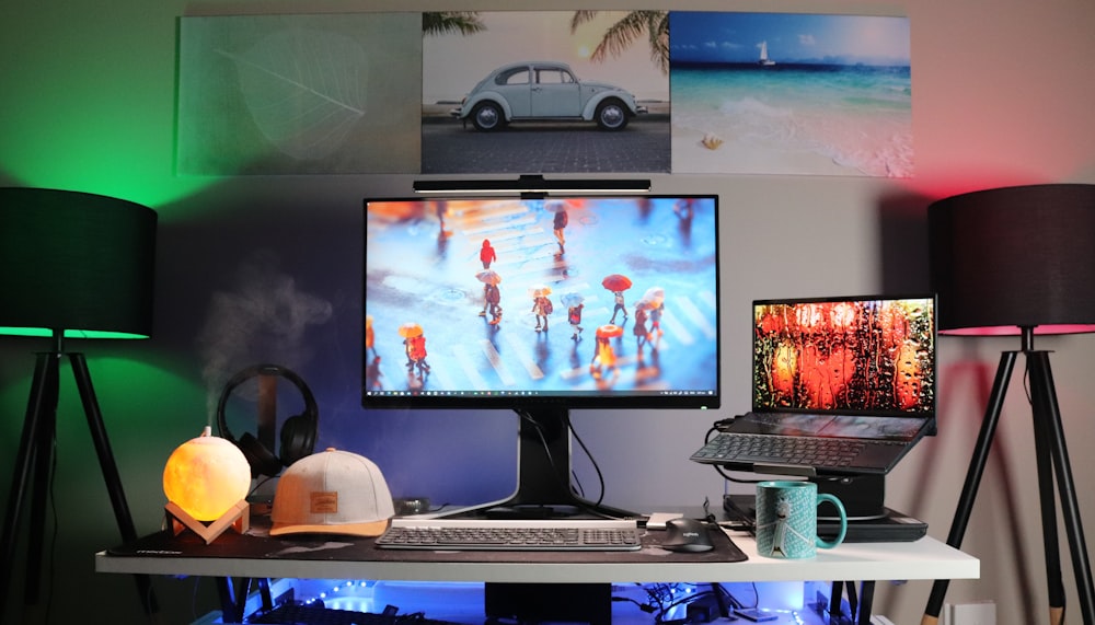 black flat screen computer monitor on white desk