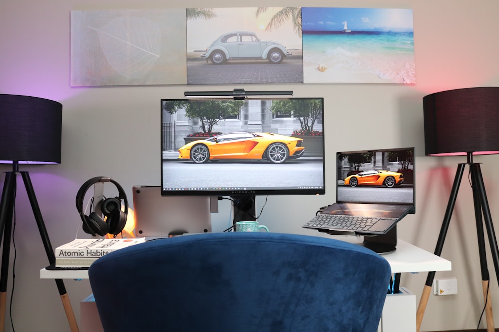 black flat screen computer monitor on white desk