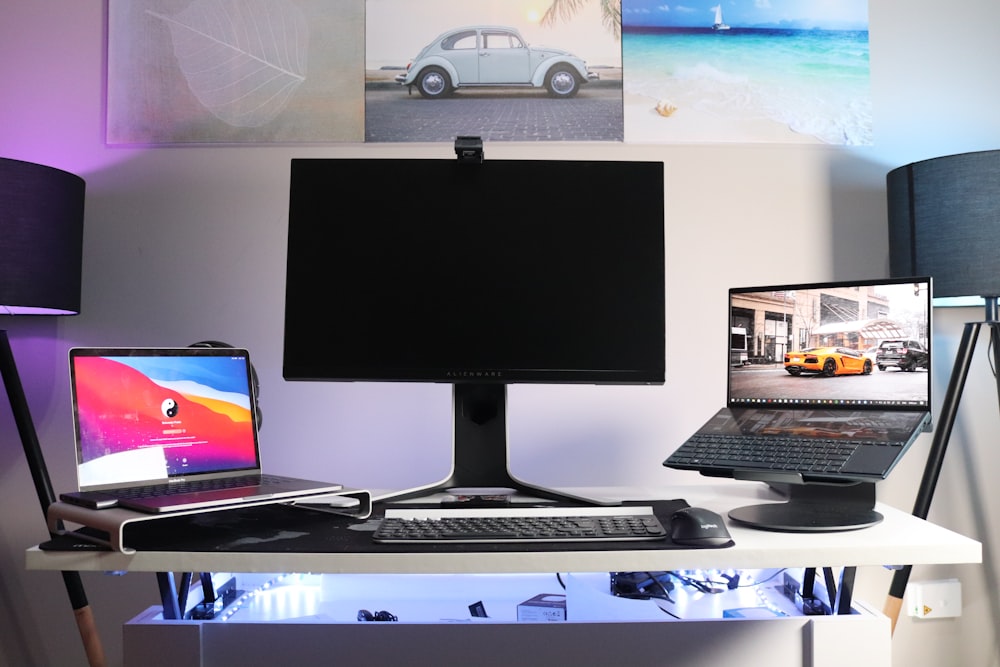 black flat screen computer monitor on white desk
