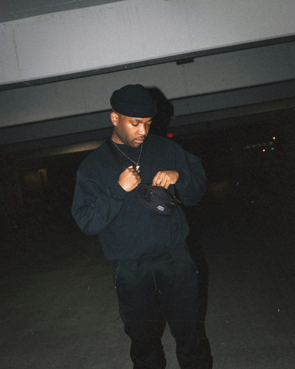 man in black jacket and black cap