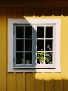 white wooden framed glass window