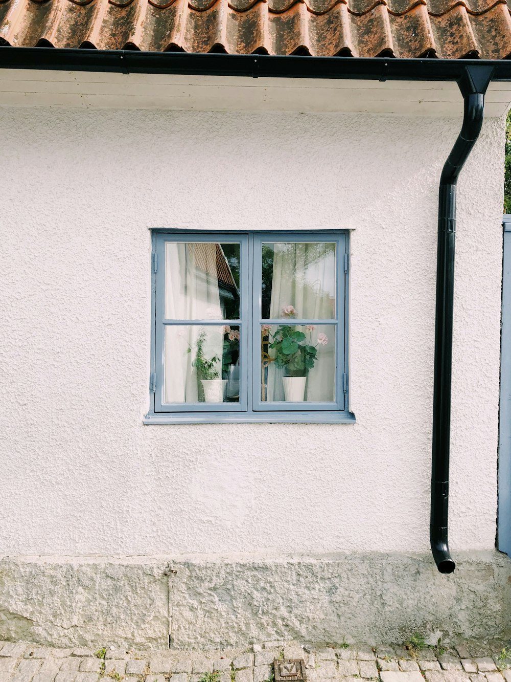 white wooden framed glass window