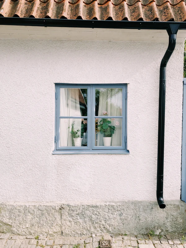 Close view of a white uPVC style framed glass window profile