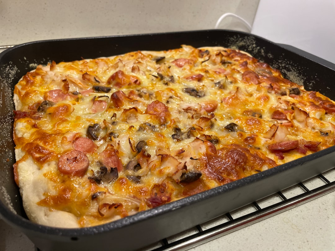 pizza on black plastic tray