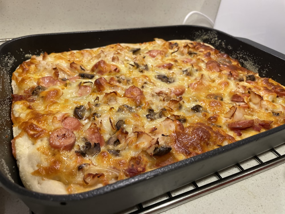 pizza on black plastic tray