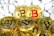 Several gold-colored coins featuring the Bitcoin logo are arranged in a pile against a backdrop of smooth white stones. One coin stands out with a red Bitcoin symbol.