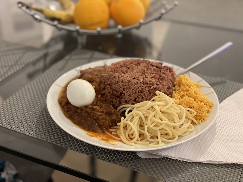 pasta with meat on white ceramic plate